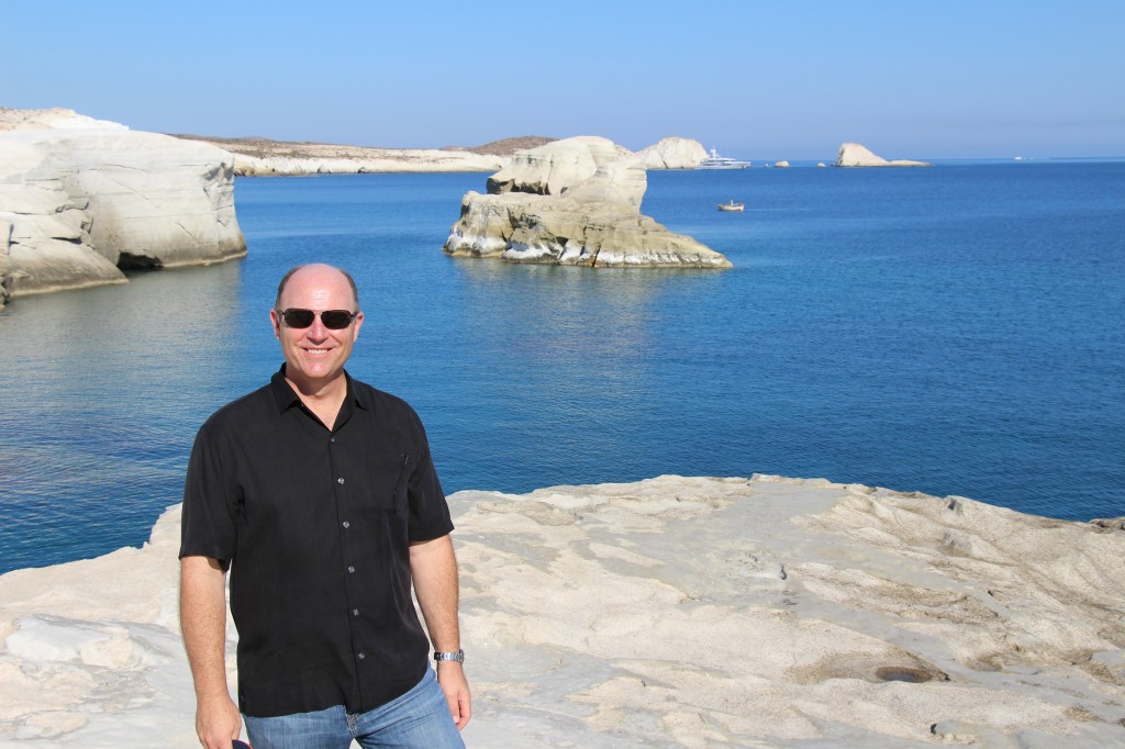 Ignore the ugly guy in the picture and notice the amazing rock formations along the coastline.